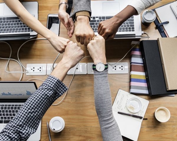 Colleagues giving a fist bump